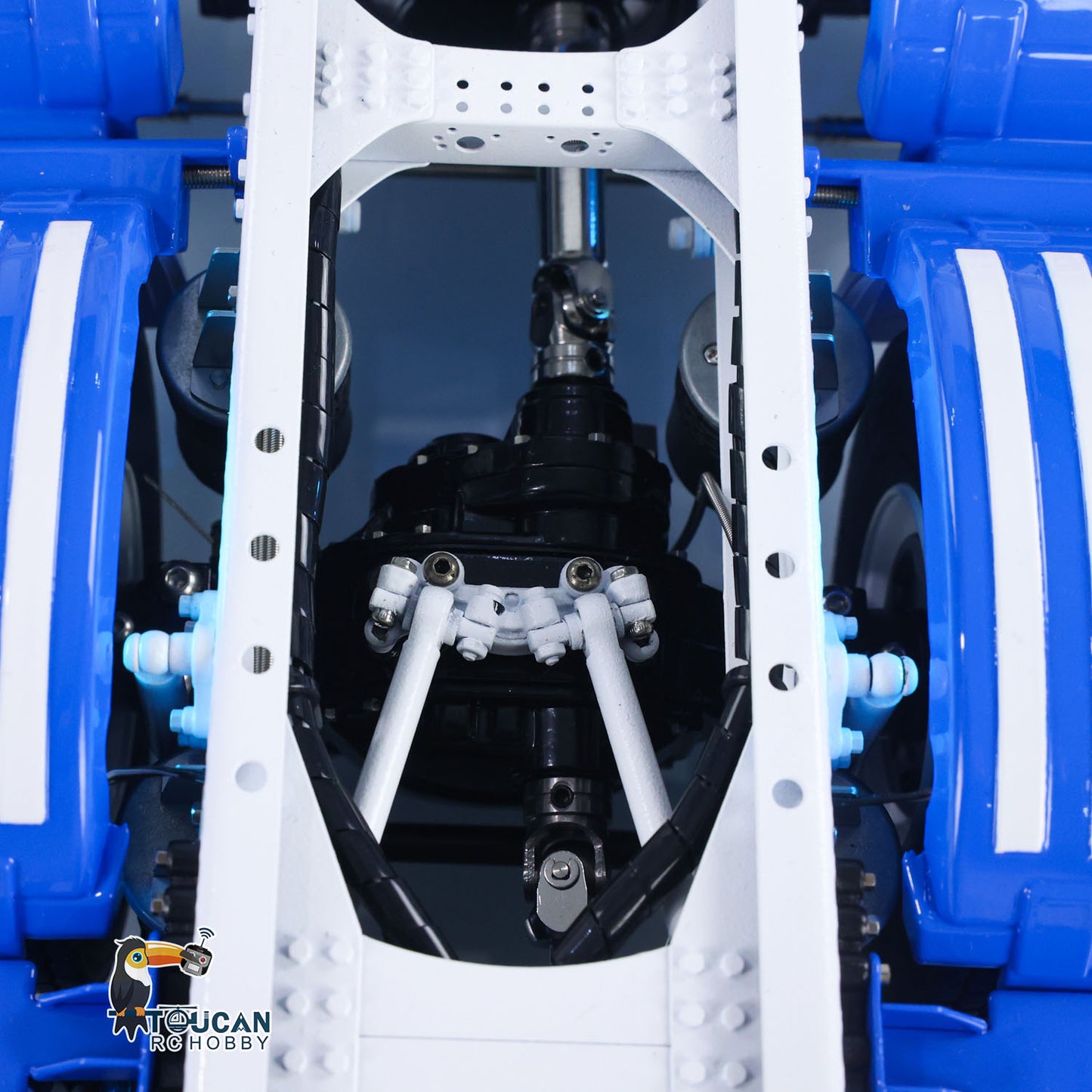 Blue and white painted 10x10 RC tractor truck, full exterior view
