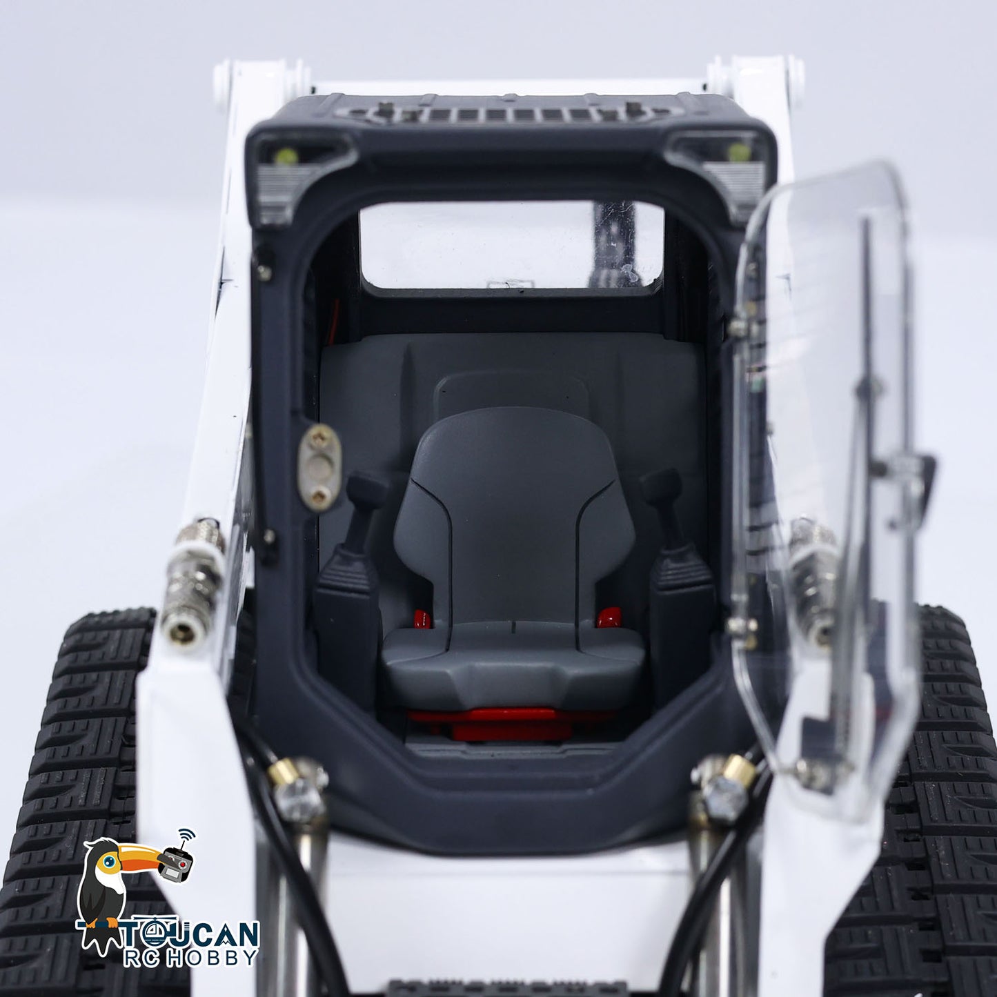 Red black RC construction skid loader SM770 TOUCAN fitted with I6S remote controller
