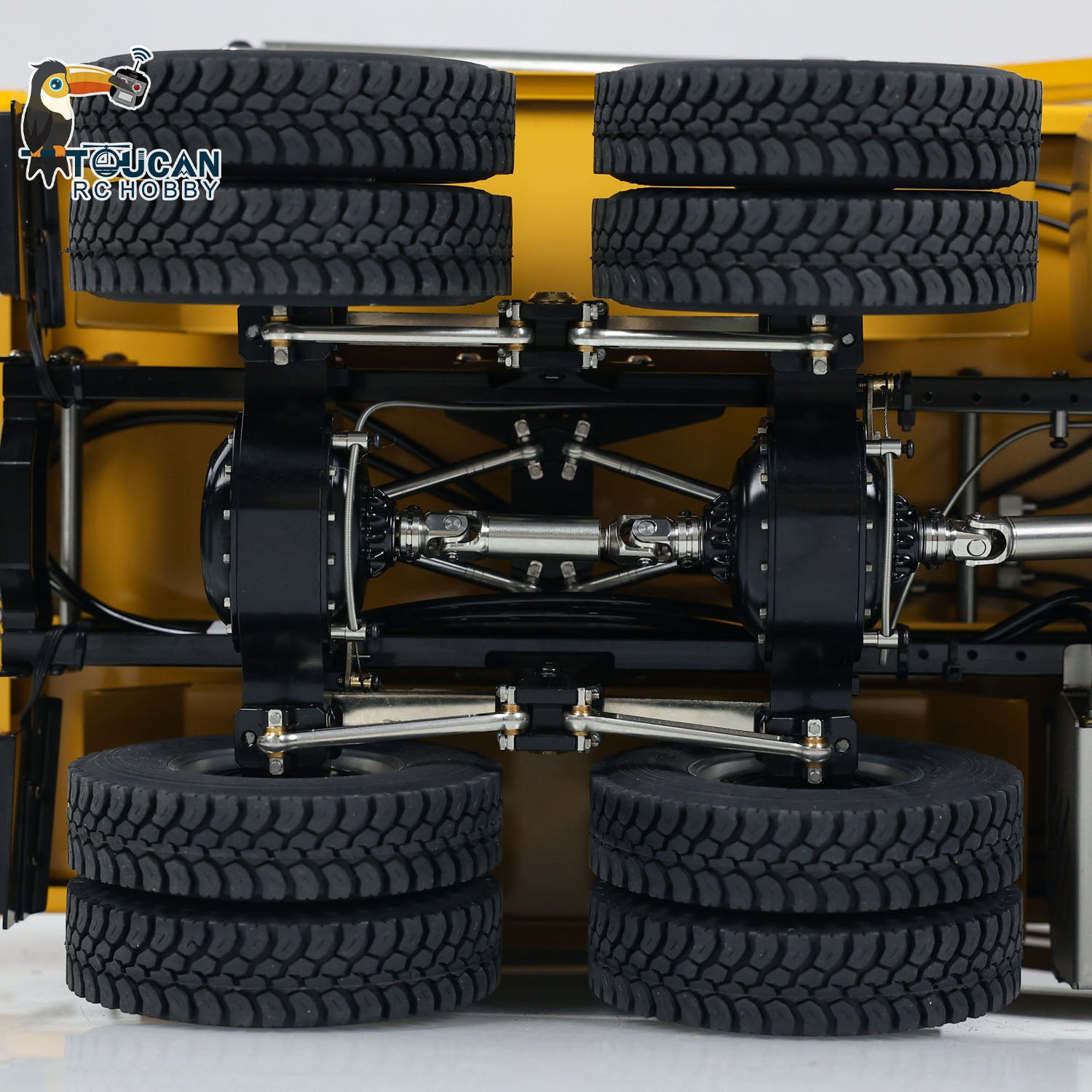 RC hydraulic dump truck with yellow cab and yellow tipping bed
