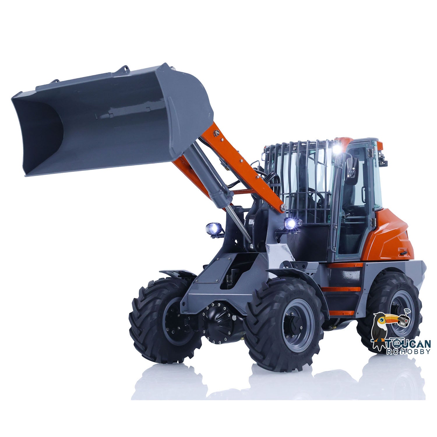 RC MCL8 wheel loader in working action with bucket lifted, 4x4 drive, motorized hydraulic arm and realistic functions
