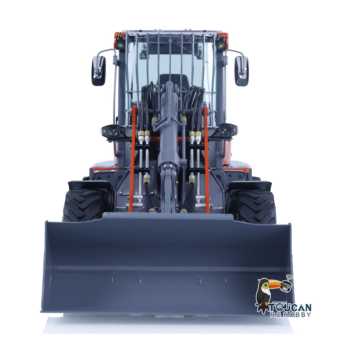 Front view of LESU MCL8 RC loader with bucket facing forward, orange gray painted cab and metal construction
