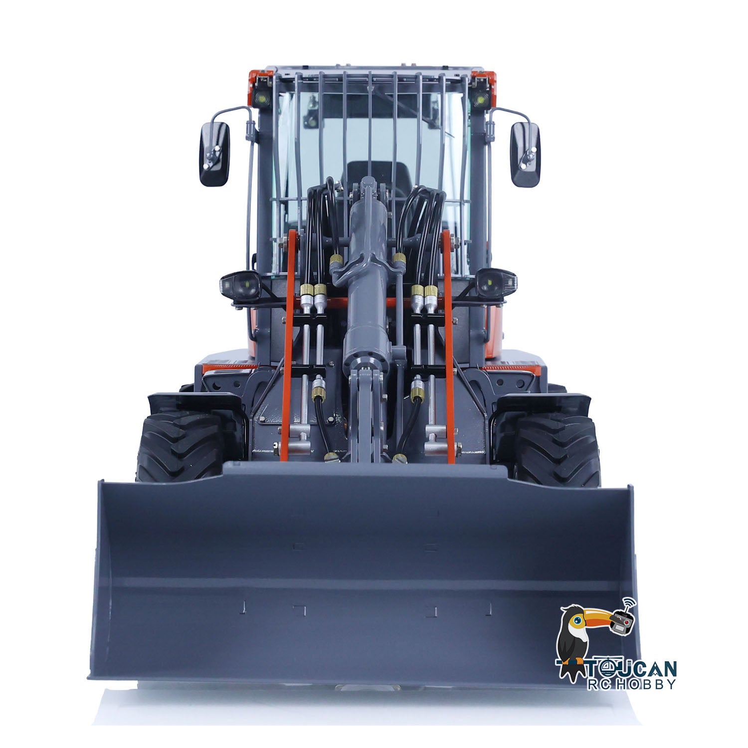 Front view of LESU MCL8 RC loader with bucket facing forward, orange gray painted cab and metal construction
